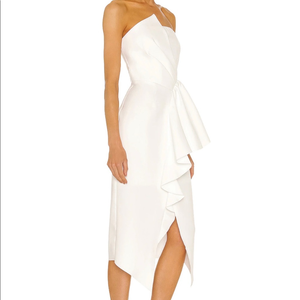 Reception Dress in Ivory
ELLIATT size small. Used only one time .